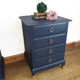 Pair of blue four drawer Stag Minstrel bedside cabinets