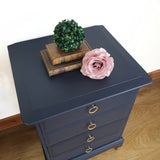 Pair of blue four drawer Stag Minstrel bedside cabinets