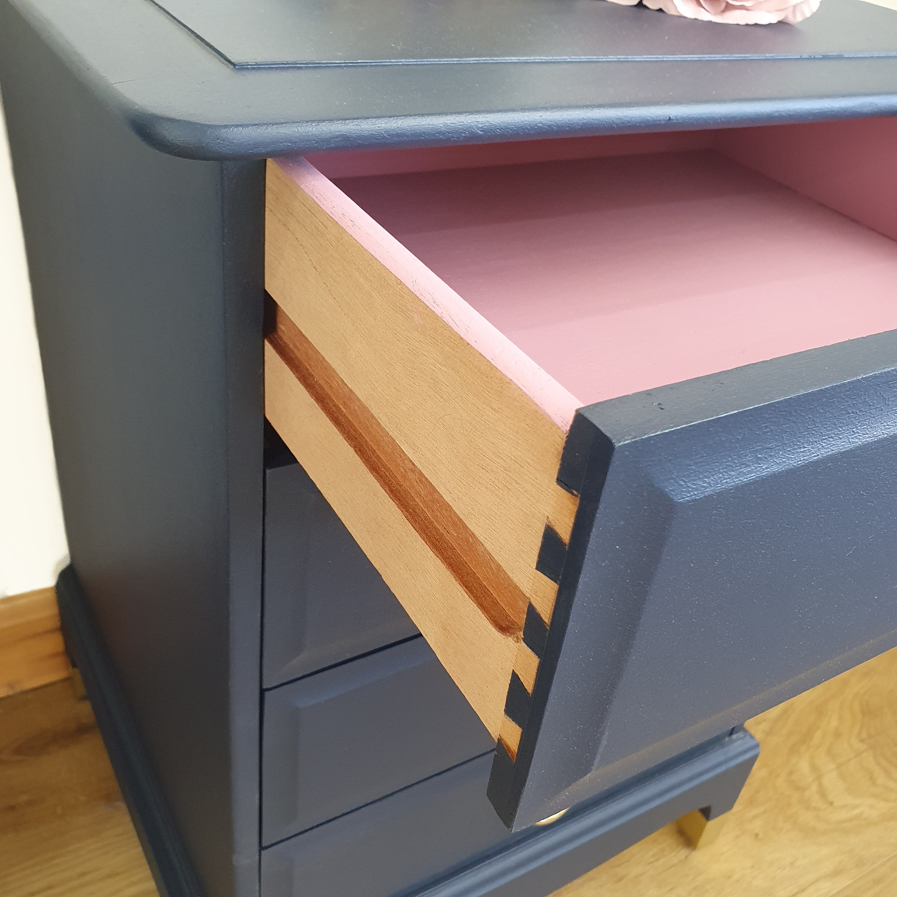 Pair of blue four drawer Stag Minstrel bedside cabinets