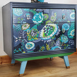 Grey mid-century chest of three drawers with découpaged fronts