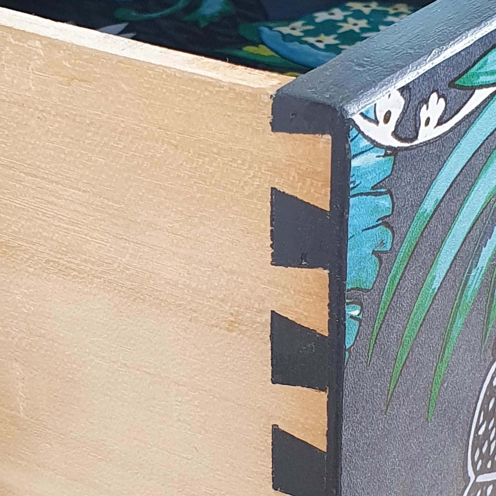Grey mid-century chest of three drawers with découpaged fronts