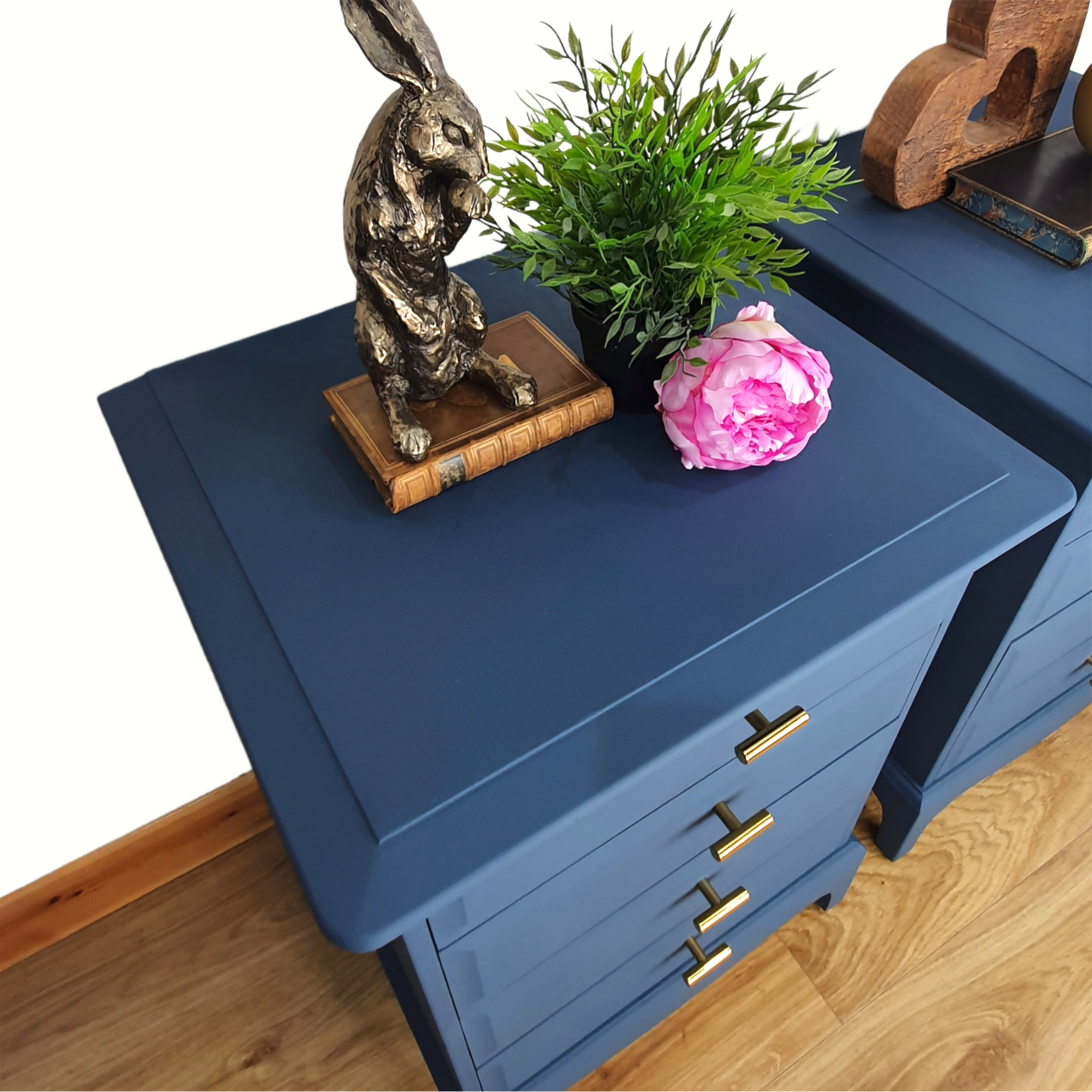 Pair of blue four drawer Stag Minstrel bedside cabinets