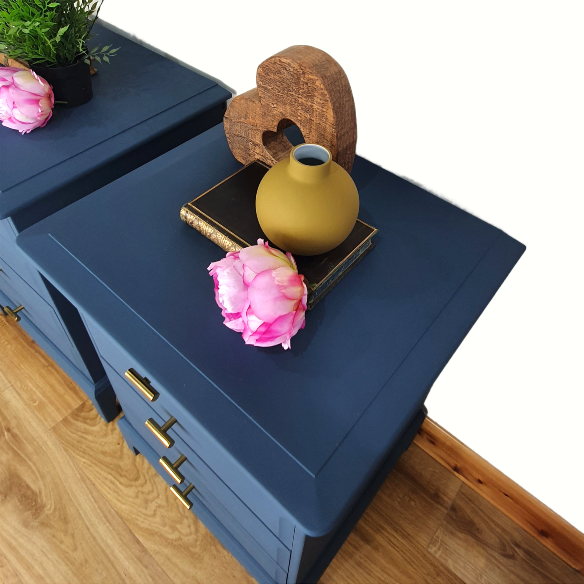 Pair of blue four drawer Stag Minstrel bedside cabinets