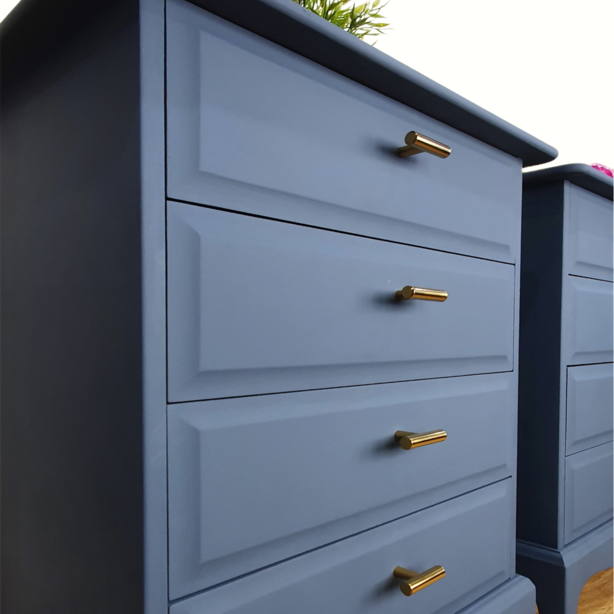 Pair of blue four drawer Stag Minstrel bedside cabinets