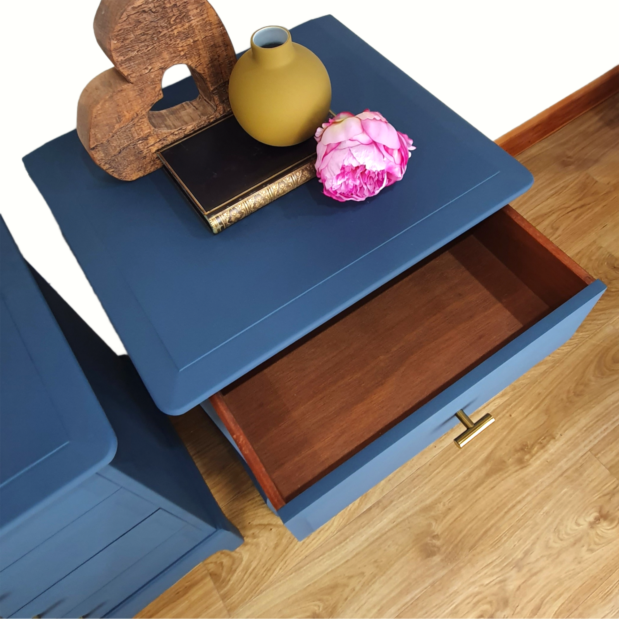 Pair of blue four drawer Stag Minstrel bedside cabinets