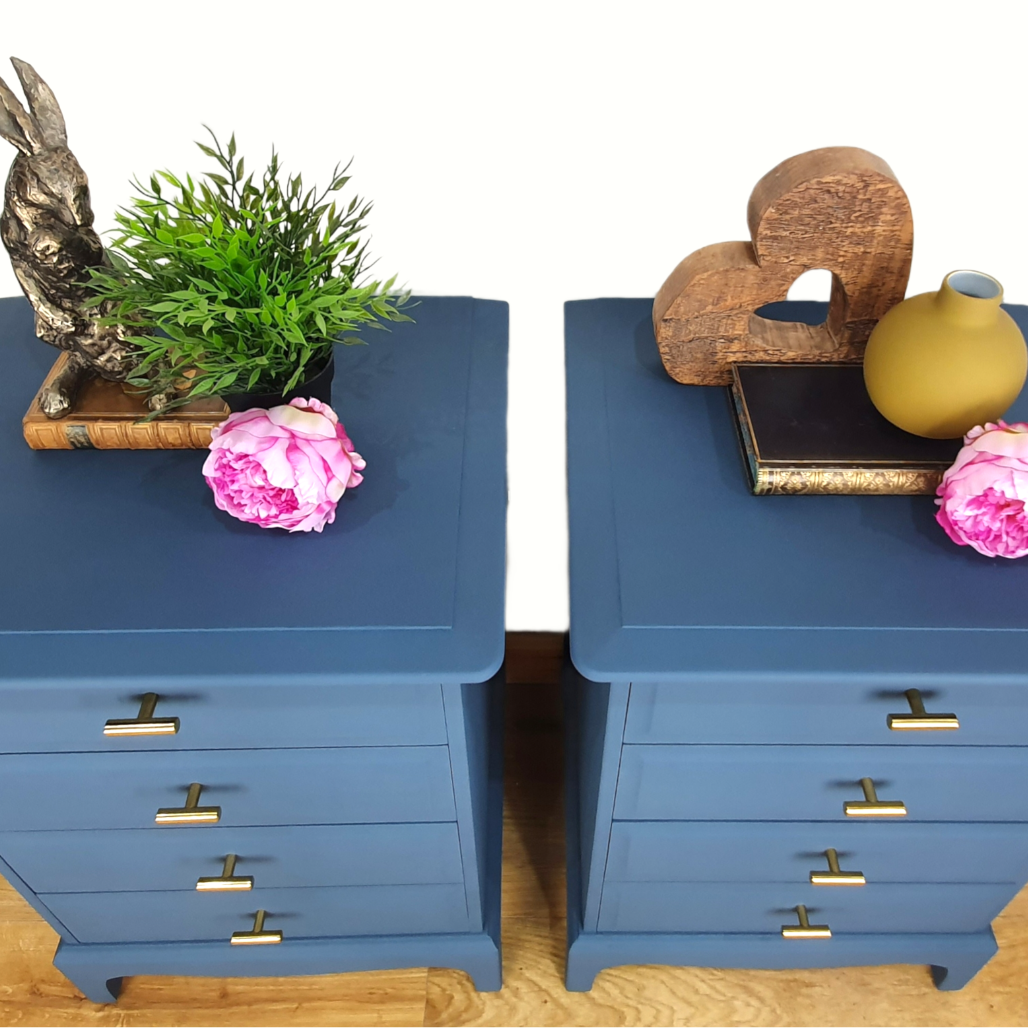 Pair of blue four drawer Stag Minstrel bedside cabinets
