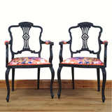 Pair of black-painted, upholstered armchairs