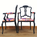 Pair of black-painted, upholstered armchairs
