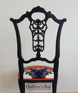 Black-painted, upholstered chair