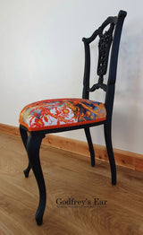 Black-painted, upholstered chair