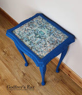 Blue side table, with découpaged top