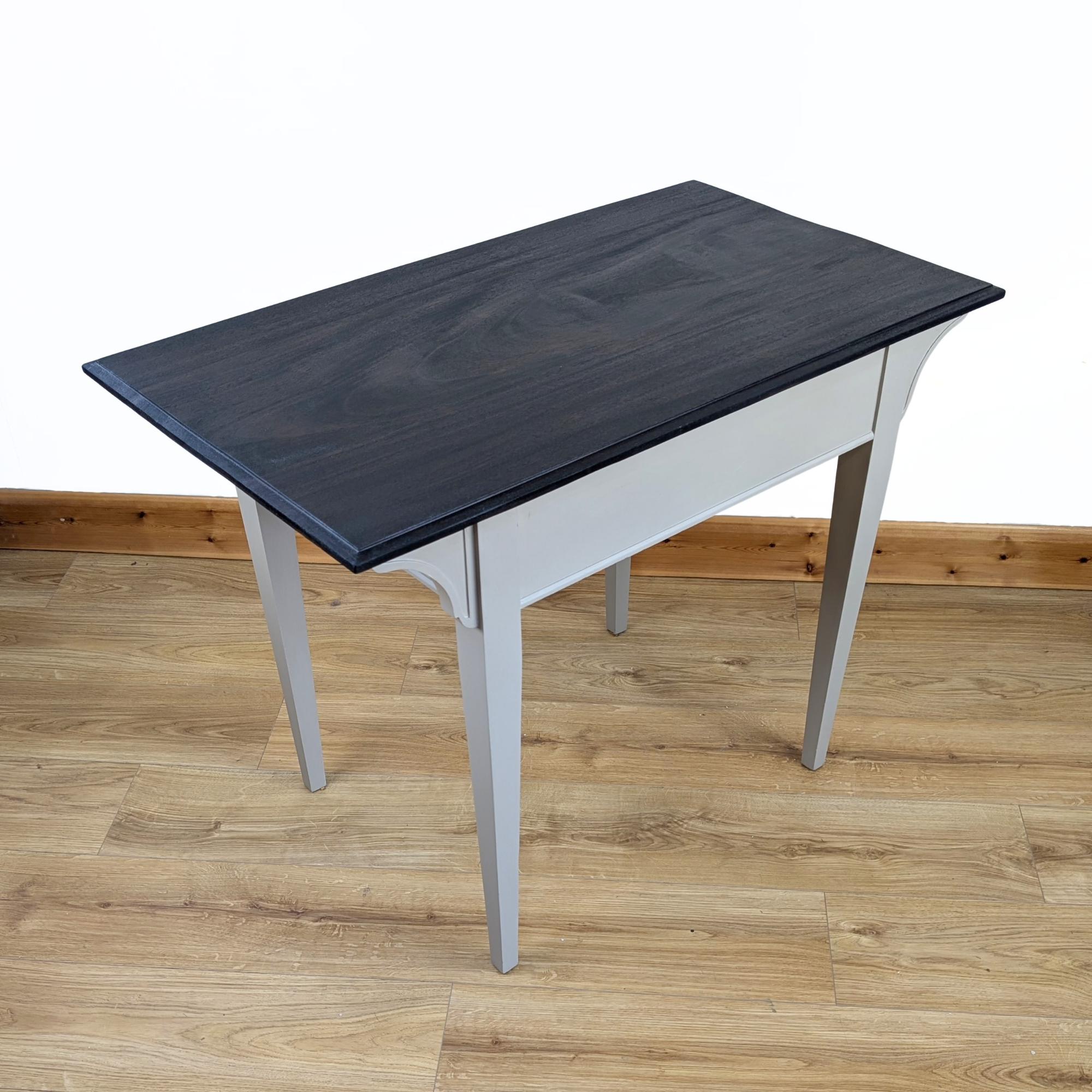 Writing table in beige with dark stained top