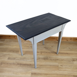 Writing table in beige with dark stained top