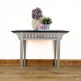Writing table in beige with dark stained top