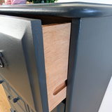 Stag Minstrel 7-drawer tallboy in dark neutral blue