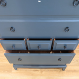 Stag Minstrel 7-drawer tallboy in dark neutral blue
