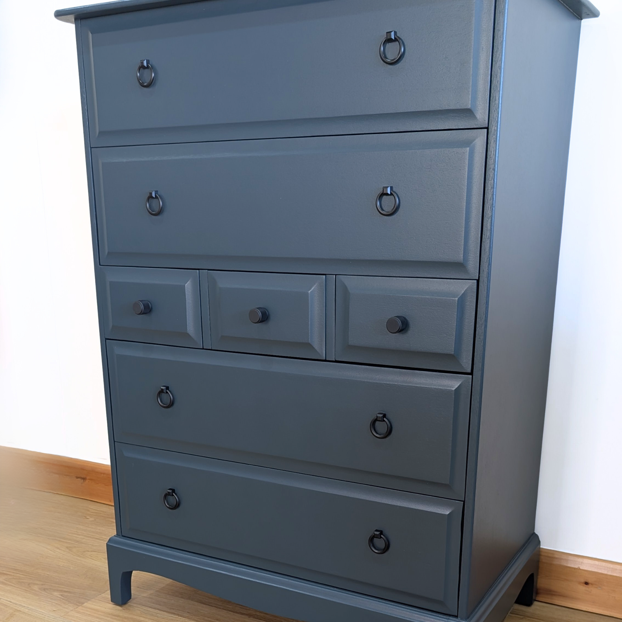 Stag Minstrel 7-drawer tallboy in dark neutral blue
