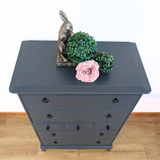 Stag Minstrel 7-drawer tallboy in dark neutral blue