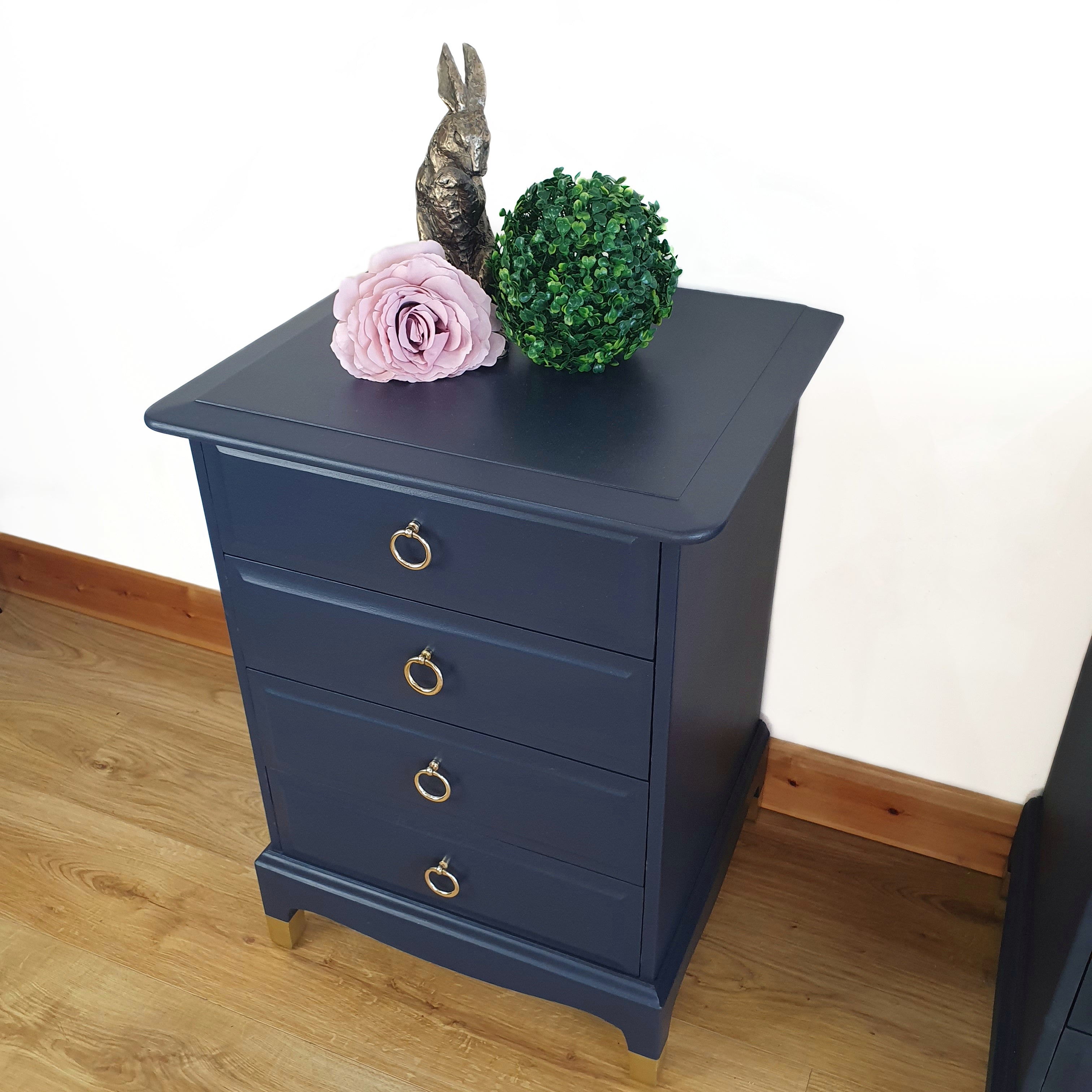 Pair of blue four drawer Stag Minstrel bedside cabinets