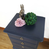Pair of blue four drawer Stag Minstrel bedside cabinets