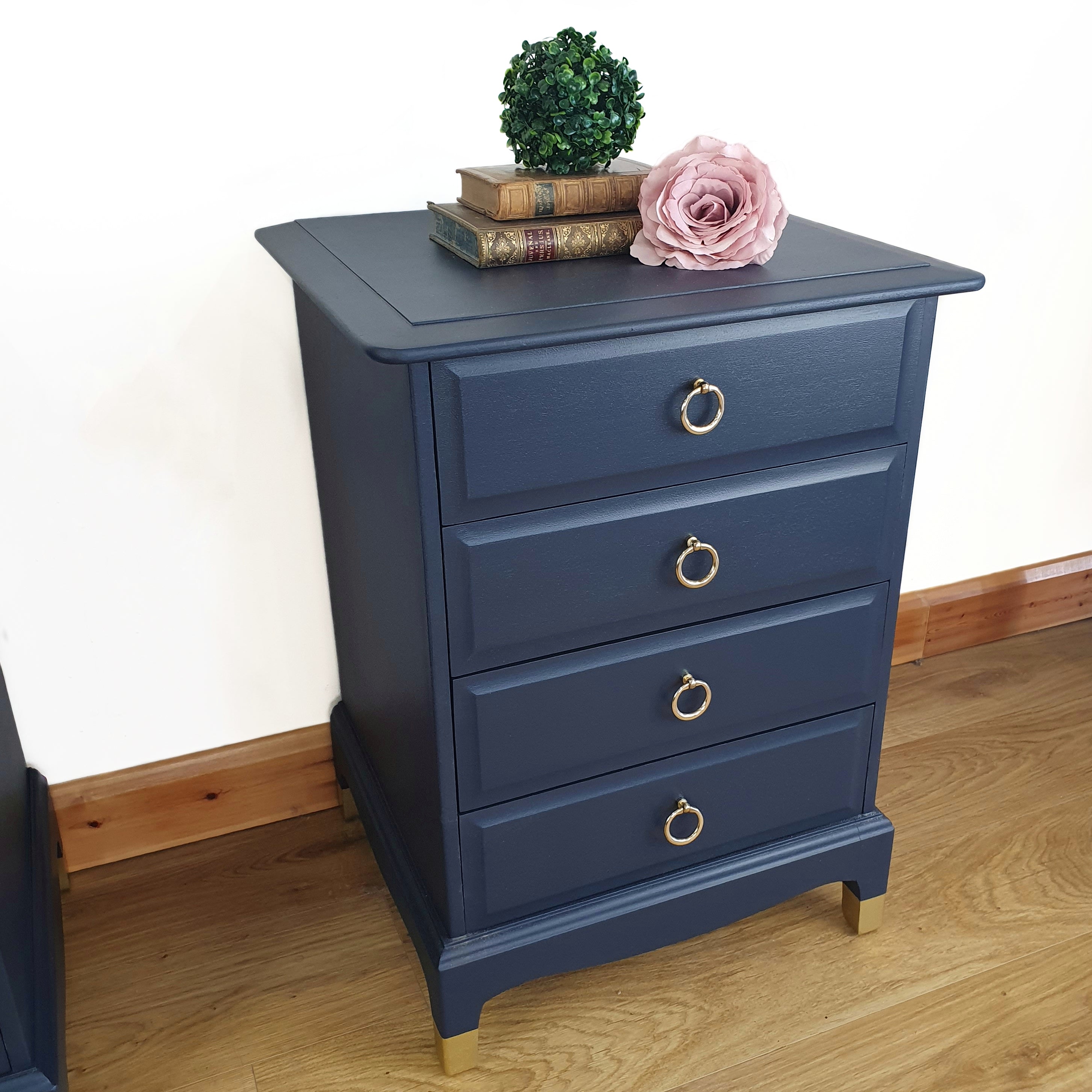 Pair of blue four drawer Stag Minstrel bedside cabinets