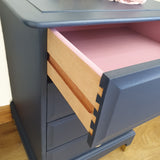 Pair of blue four drawer Stag Minstrel bedside cabinets