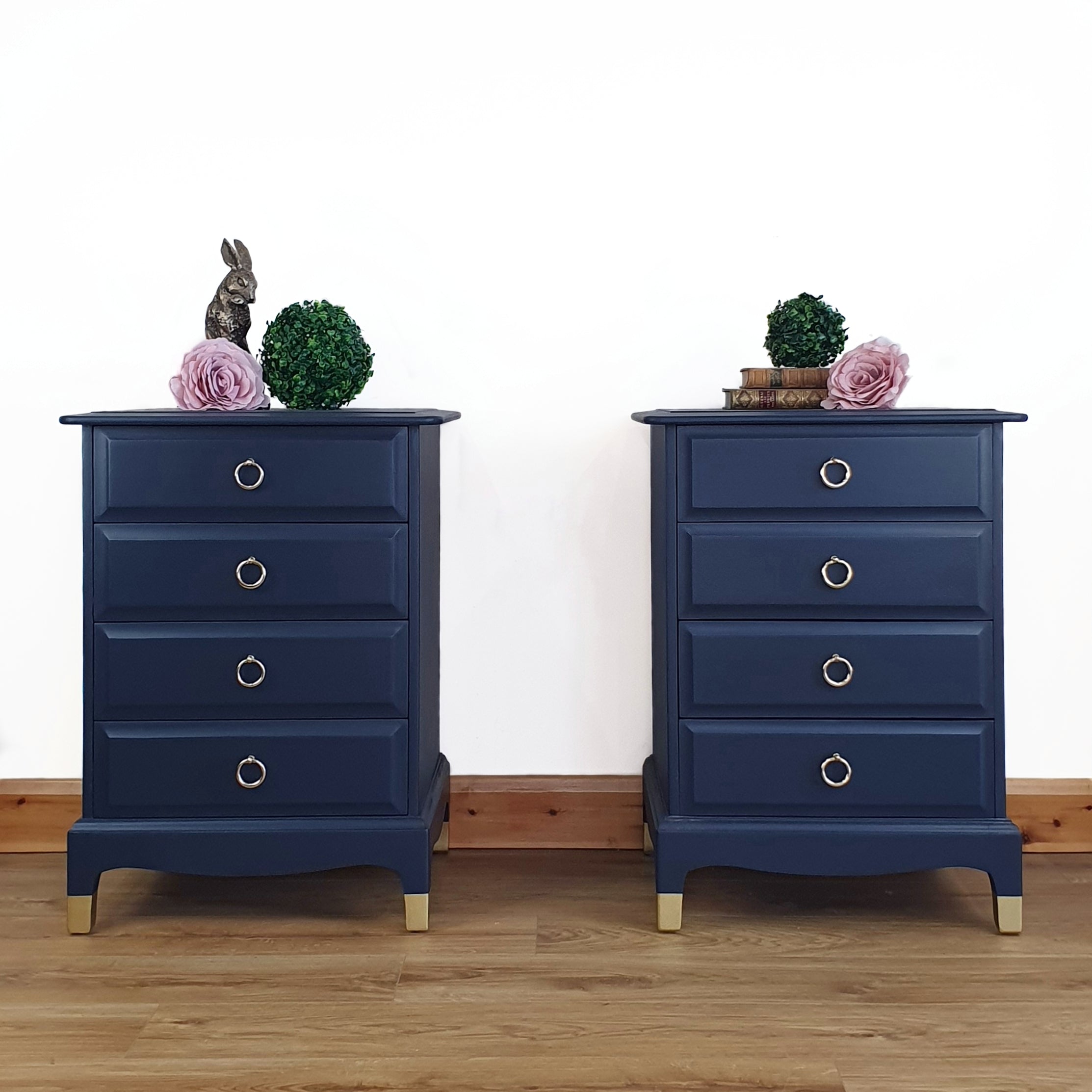 Pair of blue four drawer Stag Minstrel bedside cabinets