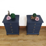 Pair of blue four drawer Stag Minstrel bedside cabinets