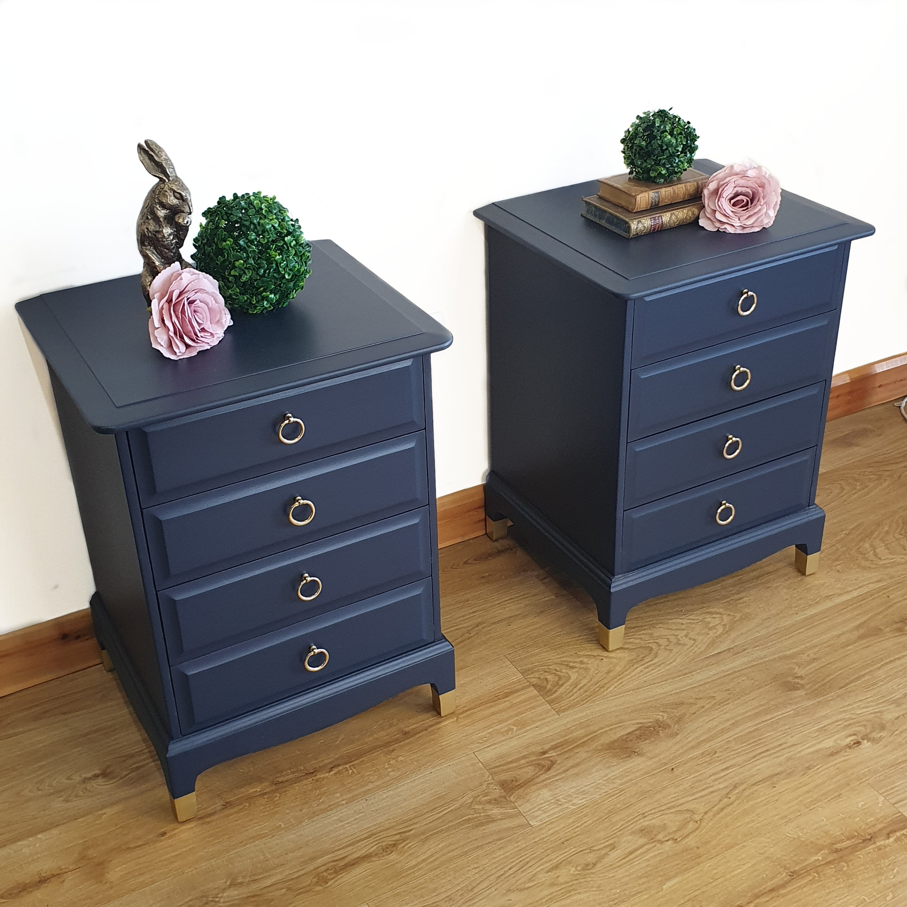 Pair of blue four drawer Stag Minstrel bedside cabinets