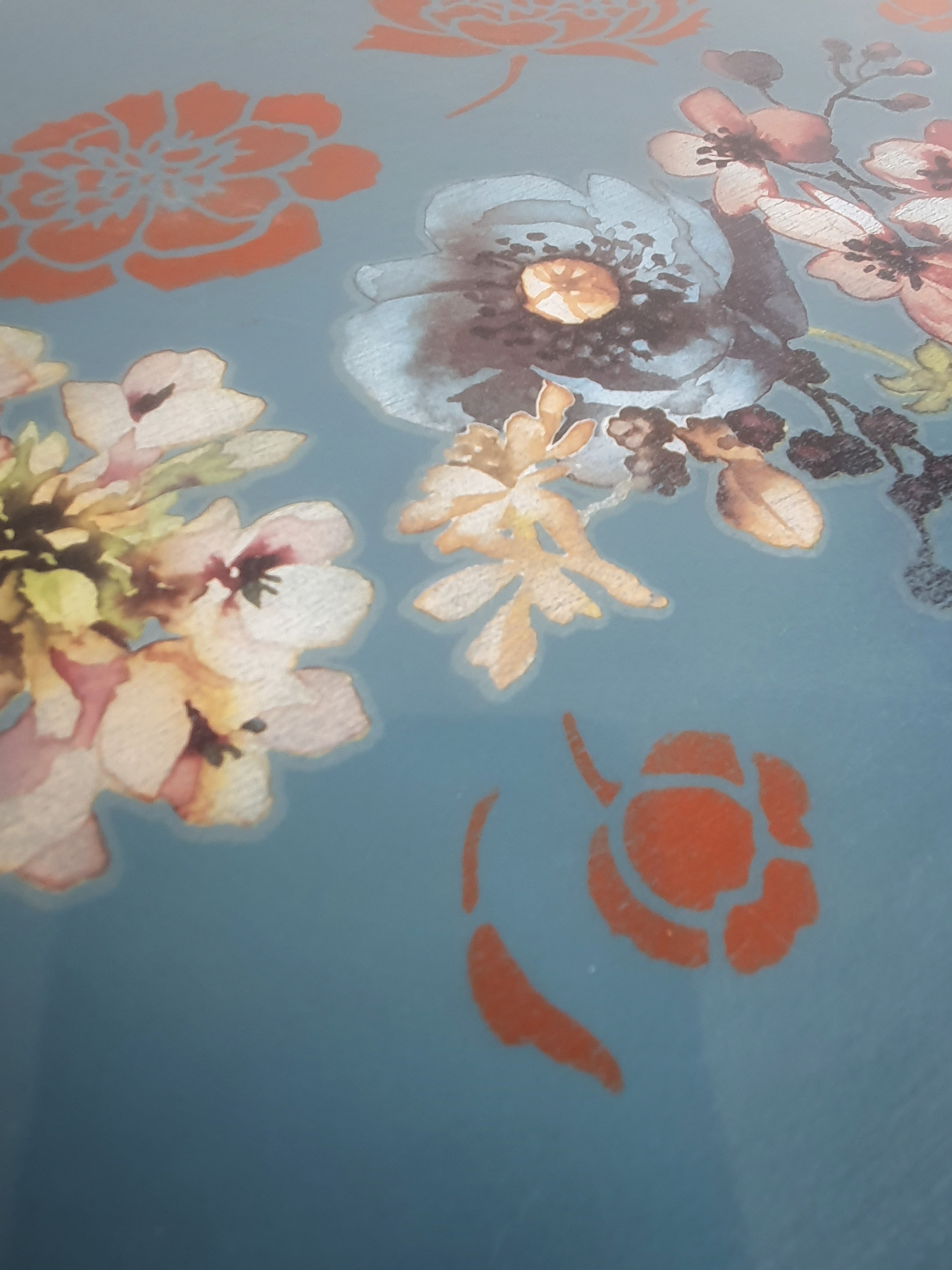 Blue tripod occasional table with floral decoration