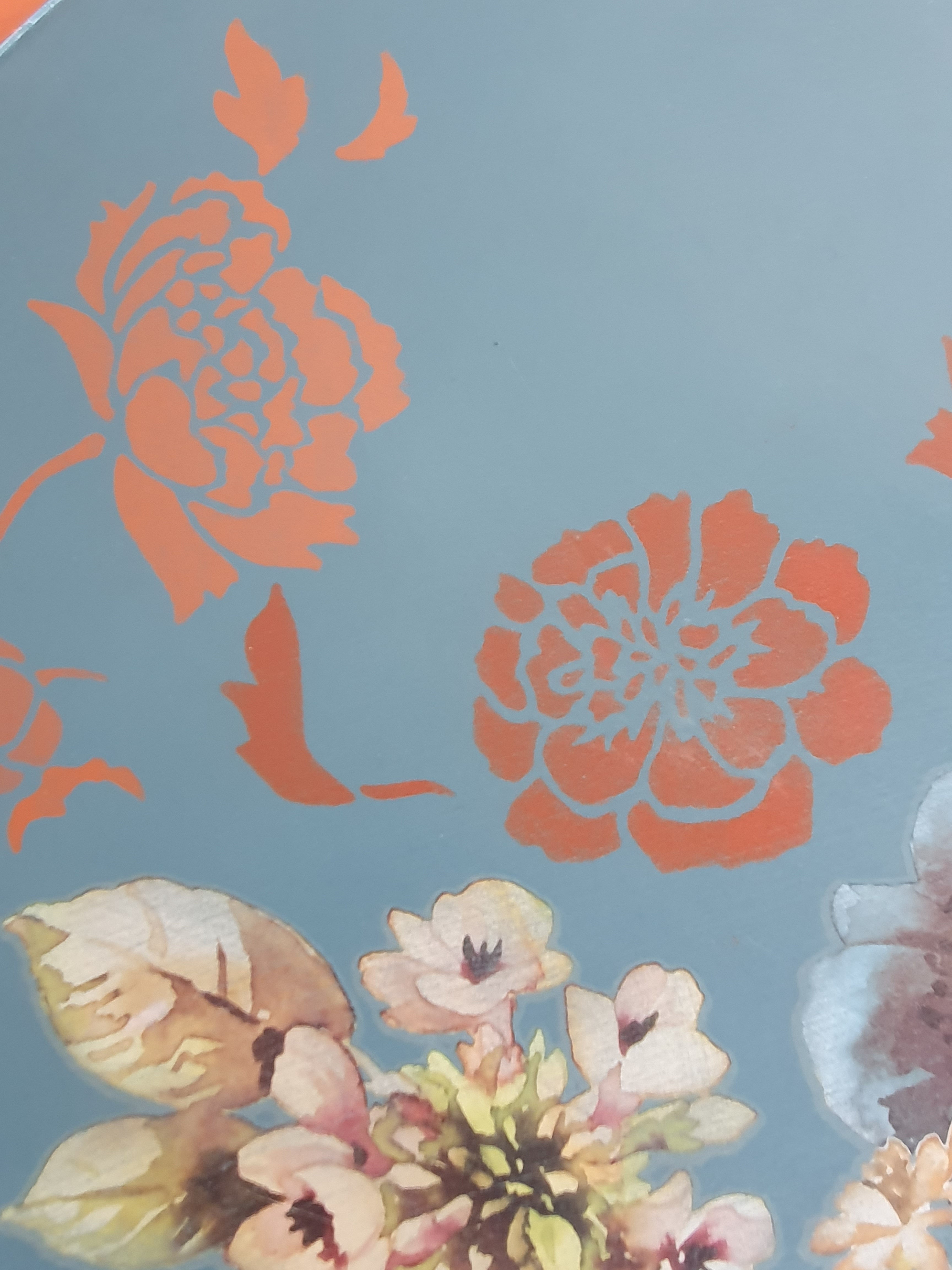 Blue tripod occasional table with floral decoration