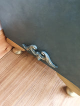 Green bedside cabinet with walnut door