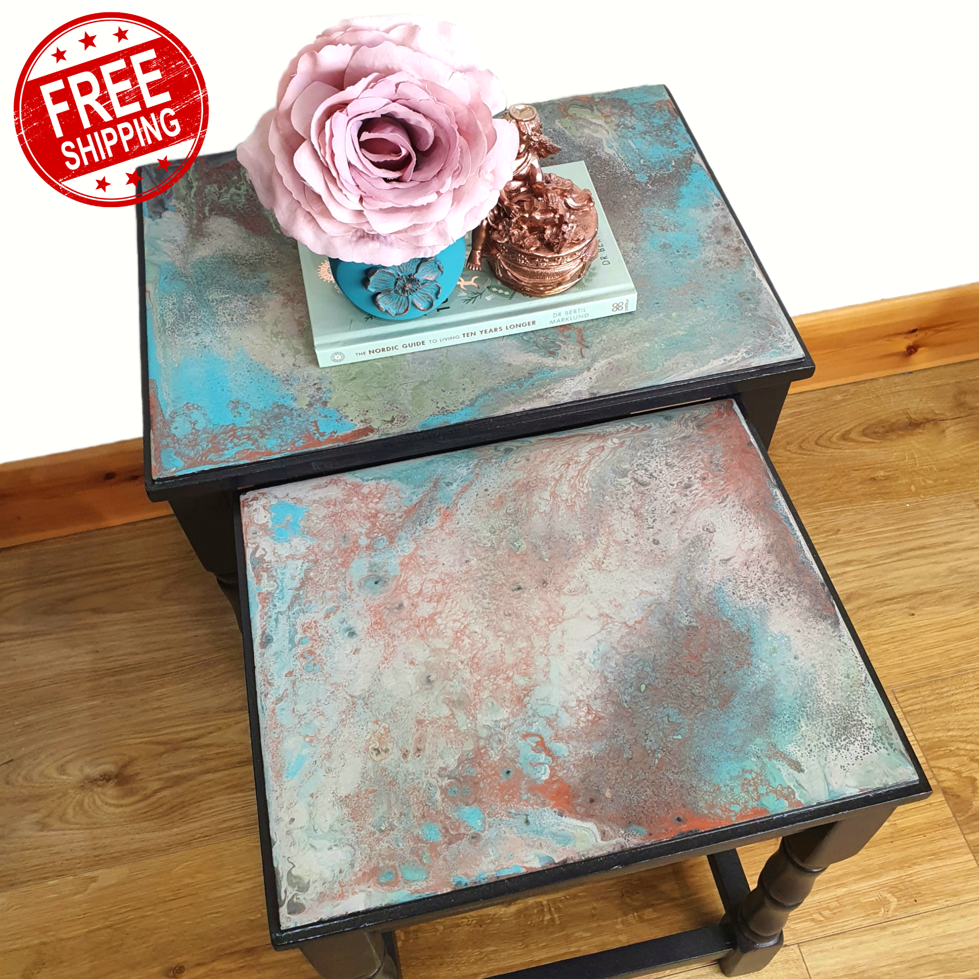 Nested pair of painted coffee tables with marbled tops