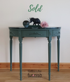 Green marble-topped demi-lune console table