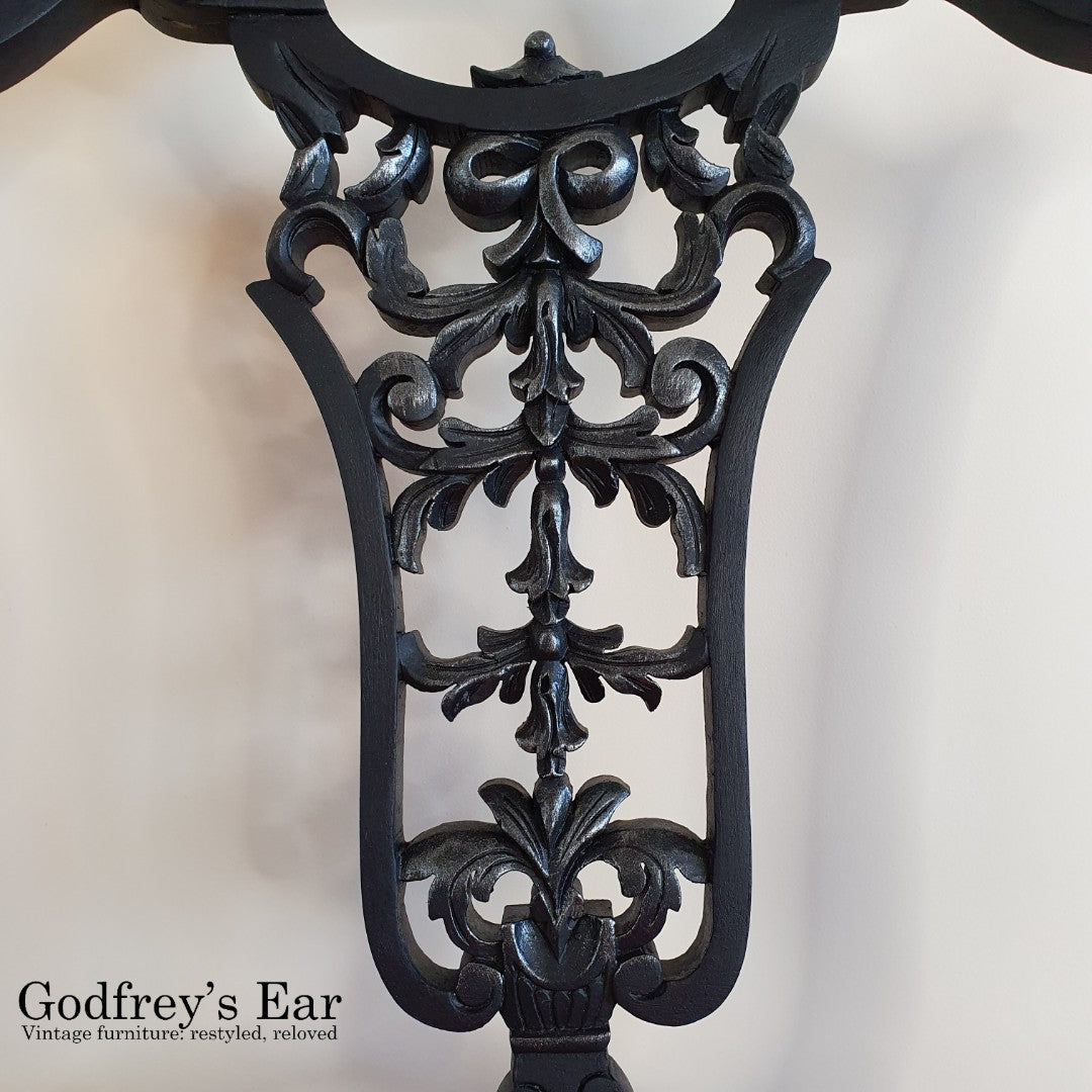 Black-painted, upholstered chair