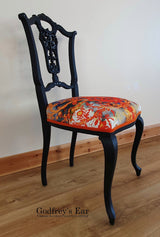 Black-painted, upholstered chair