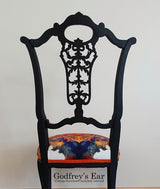 Black-painted, upholstered chair