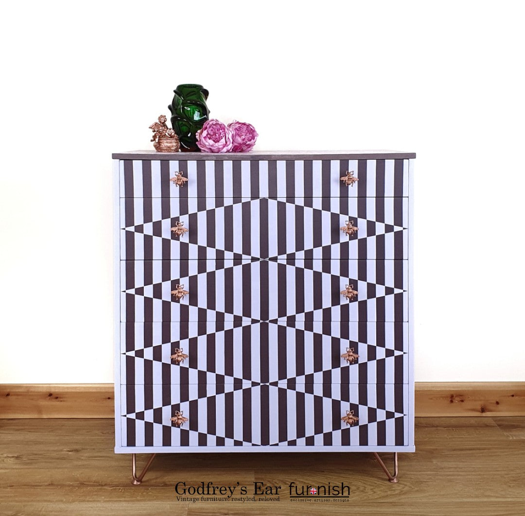 Pink Avalon chest of five drawers, with stripes and copper stencilling