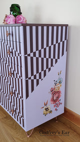 Pink Avalon chest of five drawers, with stripes and copper stencilling
