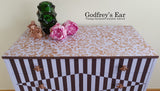Pink Avalon chest of five drawers, with stripes and copper stencilling