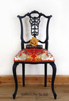 Black-painted, upholstered chair