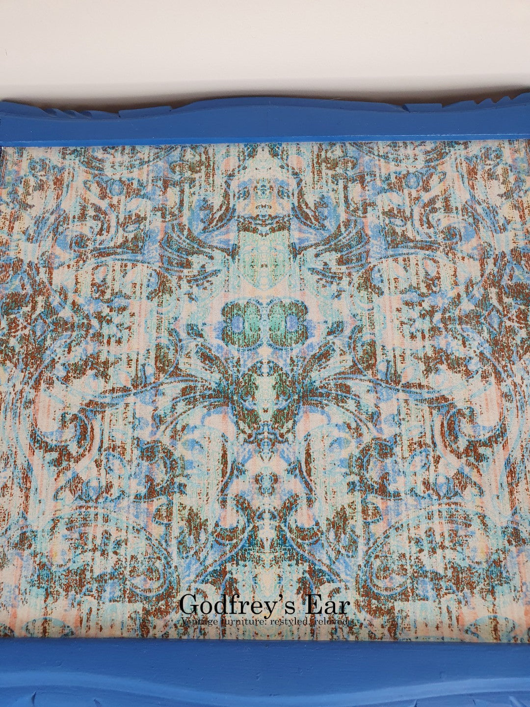 Blue side table, with découpaged top