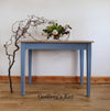 Solid oak dining table with blue legs